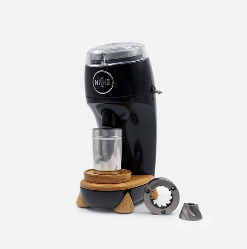 Niche Zero coffee grinder, black with wood accents, shown with conical burr set